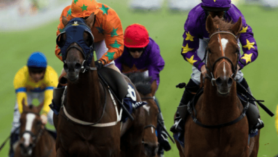 jockeys racing horses