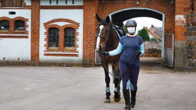 rider walking with horse